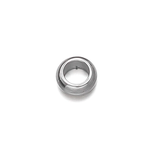 Macro detail of a silver stainless steel crimp bead with smooth polished finish for DIY jewelry