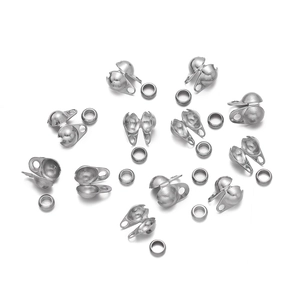 Macro detail of silver stainless steel crimp bead covers for jewelry making DIY