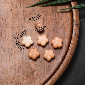 Carved bodhi root flower and gourd beads in orange moonstone for DIY jewelry making