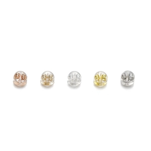 Macro view of bullet silicone earring backs with assorted metal cores for jewelry DIY