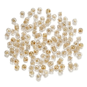 Detail of bullet-shaped silicone earring backs with gold metal core for DIY jewelry