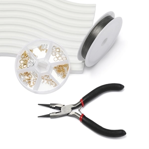 Jewelry making kit with pliers, metal wire, and beads in a round organizer box