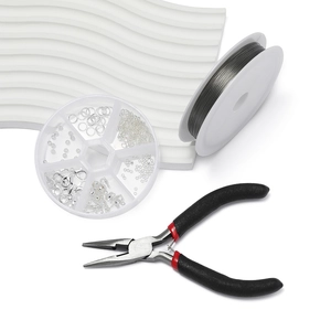 Detailed jewelry DIY kit with pliers, lobster clasps, and jump rings in a round organizer