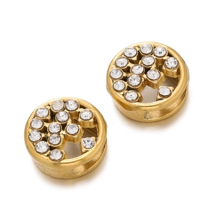 Macro shot of gold-plated crystal spacer beads with sparkling diamond inlay for DIY jewelry