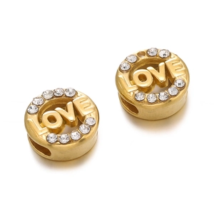 Detailed view of a gold-plated stainless steel LOVE charm bead with sparkling crystals