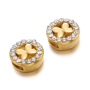 Macro detail of gold-plated butterfly spacer bead with sparkling crystal rhinestones