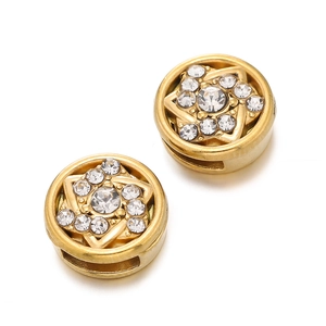 Macro detail of gold stainless steel spacer beads with star-shaped crystal rhinestones