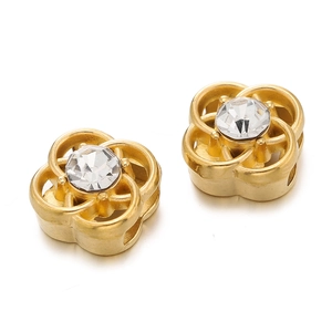 Detail of flower-shaped spacer bead with gold plating and sparkling crystal for jewelry DIY