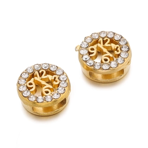 Macro detail of gold-plated clock charms with sparkling white zircons and side hole for DIY