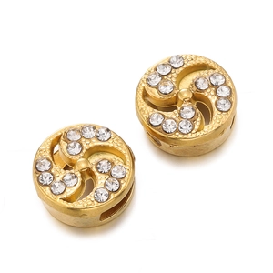 Detailed macro of gold plated spacer beads with crystal inlay for jewelry making