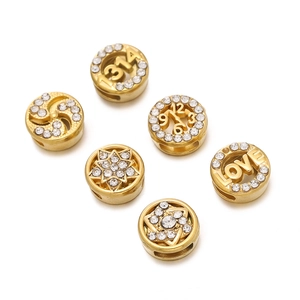 Detailed macro view of gold-plated spacer beads with crystals for DIY jewelry making