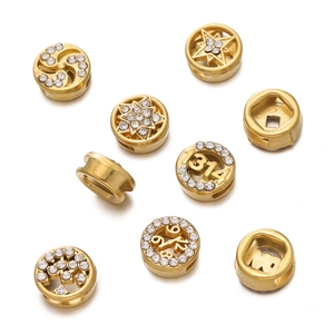 Detailed view of gold plated stainless steel spacer beads with crystal rhinestones and icons
