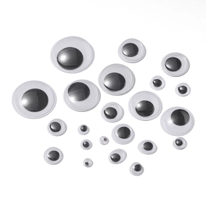 Macro view of assorted sizes of googly eyes for DIY doll making and creative crafts