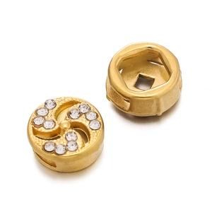 Macro shot of gold stainless steel spacer beads with crystal rhinestones for DIY jewelry