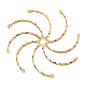 Close-up of curved gold-plated enamel tube connectors for handmade bracelet DIY jewelry