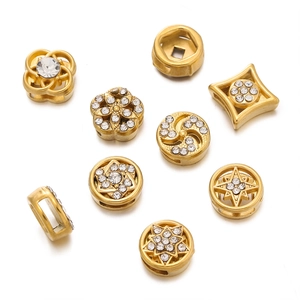 Detailed macro view of gold-plated stainless steel spacer beads with sparkling zircon stones