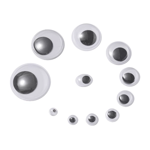 Spiral arrangement of various sized black and white googly eyes for DIY crafts