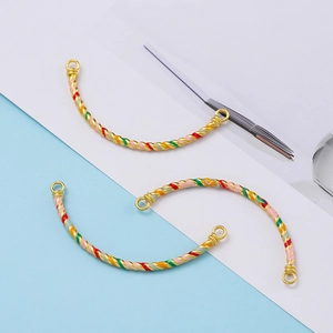 Detailed view of colorful enamel cloisonné twisted tube connectors for DIY bracelets