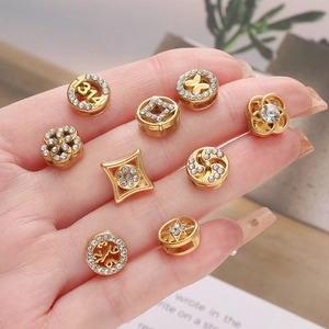 Set of 9 gold-plated crystal spacer beads with 1314 520 butterfly and star shapes