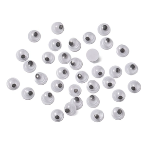 Macro shot of assorted self-adhesive googly eyes for creative DIY craft doll making
