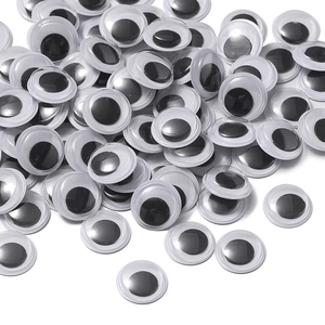 Close-up of assorted plastic googly eyes for creative DIY doll crafts and stickers