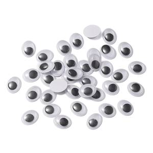 Detailed view of assorted black and white googly eyes for creative DIY craft projects