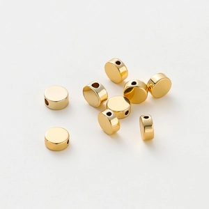 Macro shot of 14K gold plated flat round spacer beads for DIY jewelry making