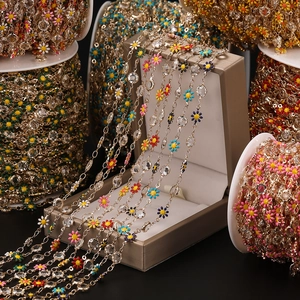 Close-up of colorful daisy enamel chains with crystals for DIY jewelry making
