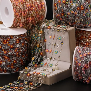 Detail of colorful enamel daisy chain with sparkling clear zircons for DIY jewelry