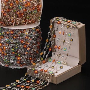 Close-up of colorful daisy flower chain with crystal beads for DIY jewelry making