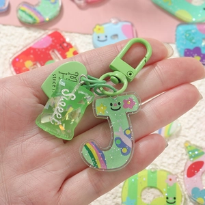 Porte-clés lettre J en acrylique vert avec motifs cartoon et breloque bonbon pailletée