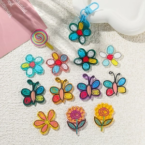 Colorful acrylic floral and butterfly charms with blue metal clasps for DIY crafts