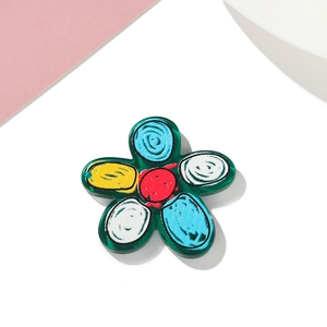 Detailed top view of colorful floral acrylic charm for DIY cream glue craft projects
