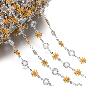 Macro view of daisy flower and rhinestone chain for DIY handmade jewelry crafts