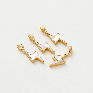 Close-up of four lightning bolt pendants with gold plating and white shell inlay details