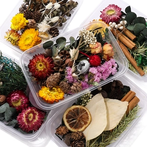 Close-up of DIY dried flower kit with pine cones, cinnamon sticks and mixed botanicals