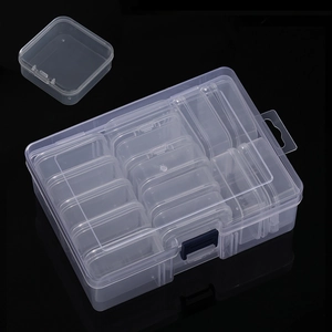 Detail of 14-grid clear plastic organizer box with individual compartments and blue latch