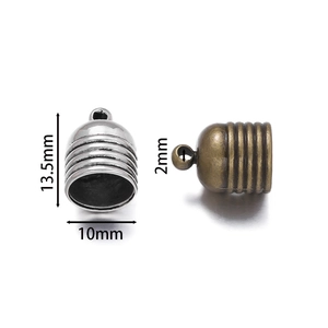 Detail view of zinc alloy tassel end caps in silver and bronze for DIY jewelry making