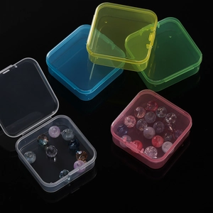 Close-up of colorful 14-compartment plastic organizers for beads and small craft items