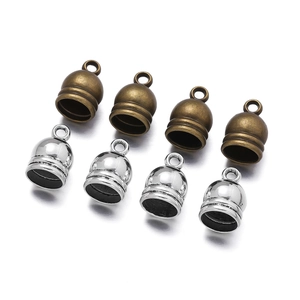 Macro detail of bell-shaped zinc alloy tassel caps with grooved design for DIY jewelry