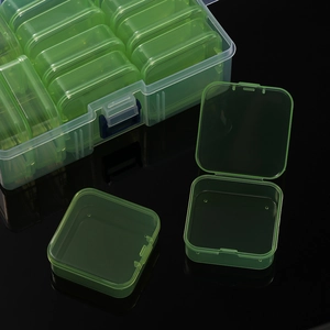 Detail of light green detachable small boxes inside a clear plastic storage container