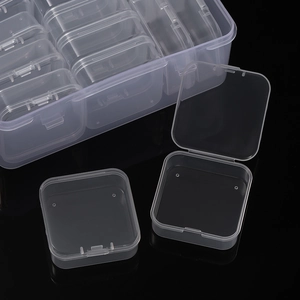 Macro shot of 14-grid clear plastic storage box showing individual lidded compartments