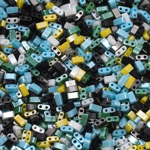 Macro shot of assorted colorful glass rectangle beads with two-hole design for DIY jewelry
