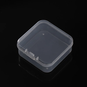 Macro shot of a transparent square plastic organizer box with a secure snap closure