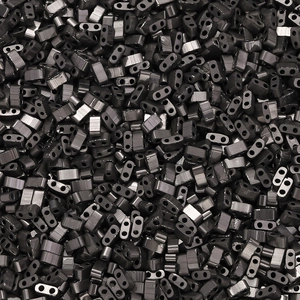 Close-up of metallic gunmetal glass beads with double holes for DIY jewelry making