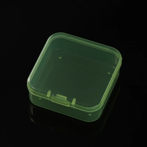 Detail of a translucent green plastic storage box with a secure snap closure for beads