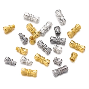 Macro detail of gold and silver copper screw clasps for DIY necklace jewelry making