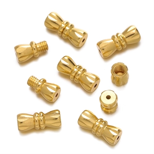 Detailed view of gold screw clasps for jewelry making showing threaded closing mechanism