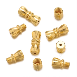 Detailed view of golden screw clasps for jewelry making with threaded connector design