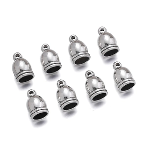 Detailed view of polished silver bell-shaped cord end caps with top hanging loops
